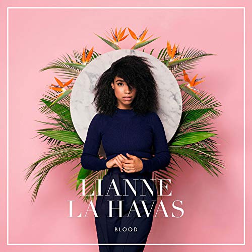 "Lianne La Havas album cover featuring a woman surrounded by tropical leaves on pink background."