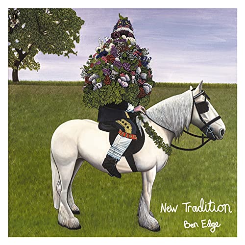 A person wearing a large floral headpiece rides a white horse in a field.