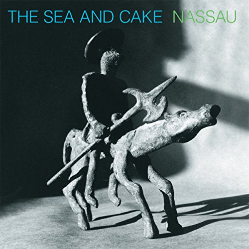 Album cover for The Sea & Cake’s “Nassau” featuring a carved figure with an animal.