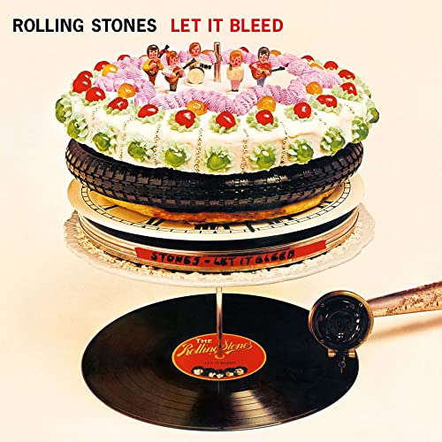Rolling Stones “Let It Bleed” album cover: cake with tires and figures.