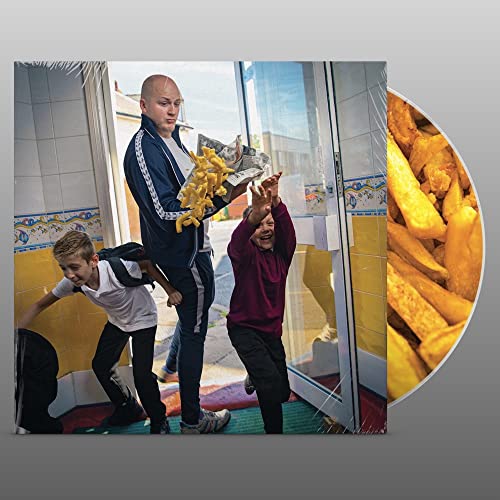 CD cover: three people with chips near a fish and chip shop.
