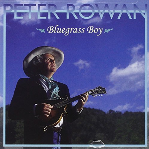 Album cover with man in hat holding mandolin against blue sky and trees.