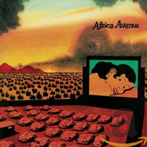 Album cover with a large screen showing a woman above a parkingLS parking lot.