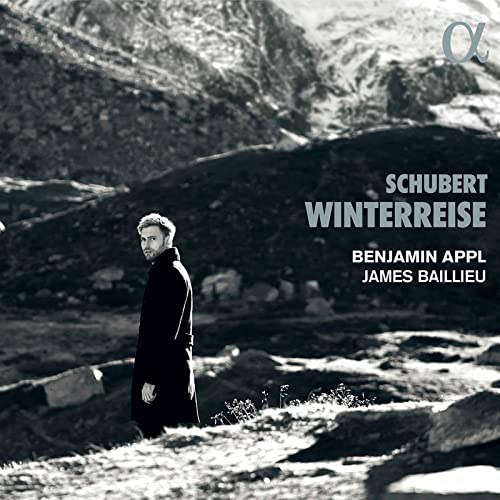 CD cover: Man in black coat stands in a wintry landscape.