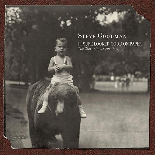 Black and white album cover featuring a young boy on a bear.