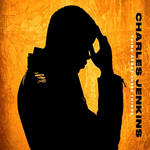 Silhouette of a man’s head against an orange textured background.