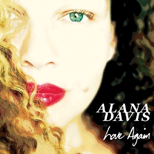 "Album cover featuring a close-up of a woman's face with green eyes and red lips."