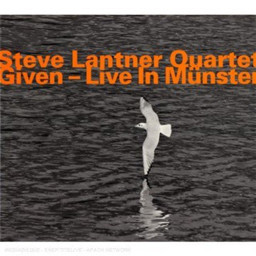 "CD cover with a seagull flying over water, orange text, and Amazon logo."