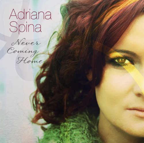 "CD cover with a close-up of a woman's face, green and red hair."
