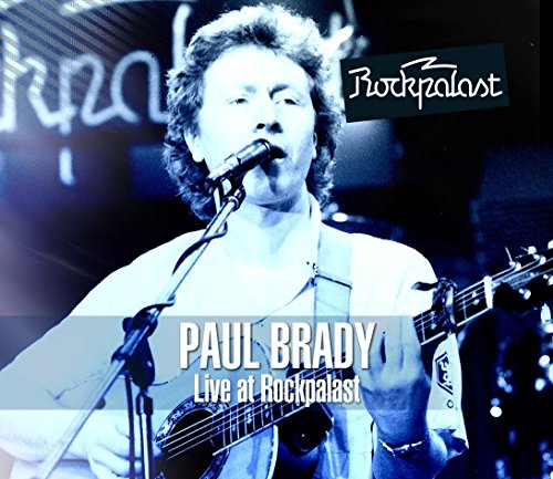 "Album cover featuring Paul Brady singing into a microphone with an acoustic guitar."