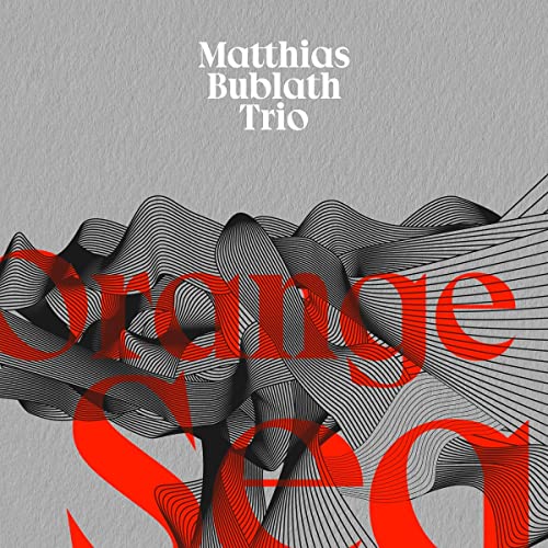 CD cover for "Orange Sea" by Matthias Bublath Trio, abstract waves.