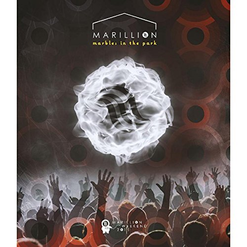 "Blurry white orb above raised hands of crowd, Marillion logo and text."