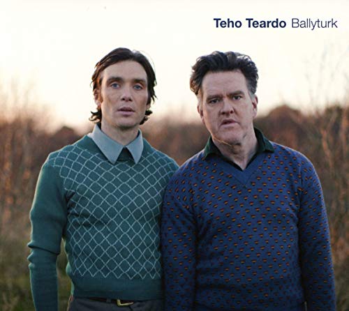 CD cover featuring two men in patterned sweaters, standing outdoors.
