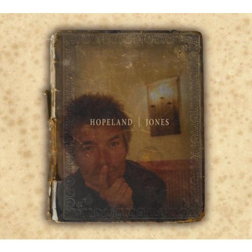 "CD case with worn cover, man with finger to lips, on speckled beige background."