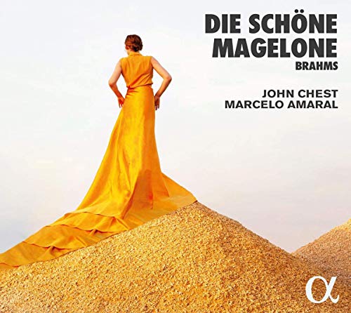CD cover featuring a woman in a long yellow dress standing on a sand dune.