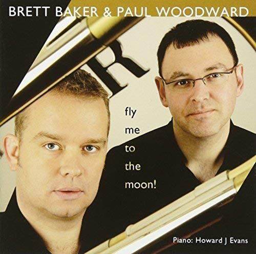 "Album cover featuring two men, one holding a trumpet, with text 'Fly Me to the Moon'."