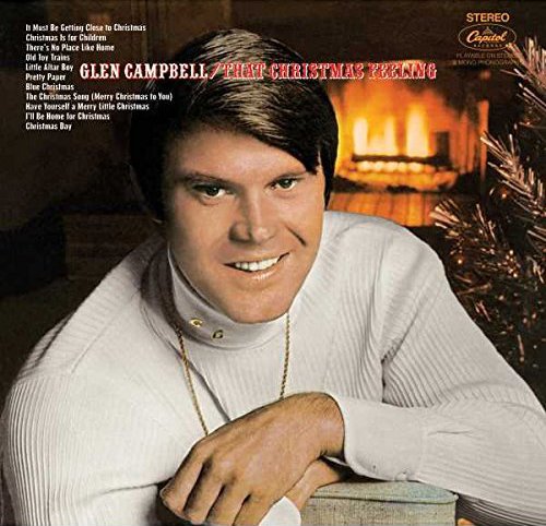 Vinyl record cover featuring Glen Campbell in a white sweater by a Christmas tree.
