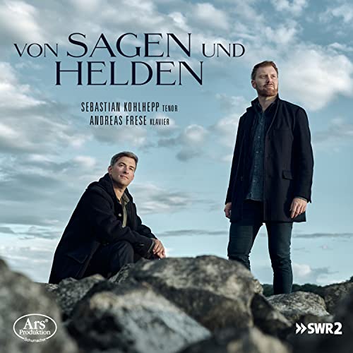 CD cover: two men in coats stand on rocky terrain under clouds.
