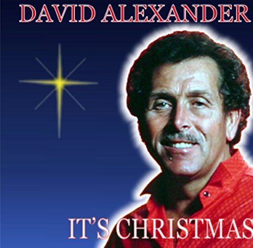 "Christmas album cover featuring a family of four surrounded by festive decorations and greenery."