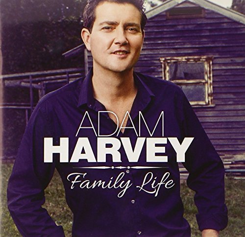 "Album cover featuring a man in a purple shirt with text overlay."