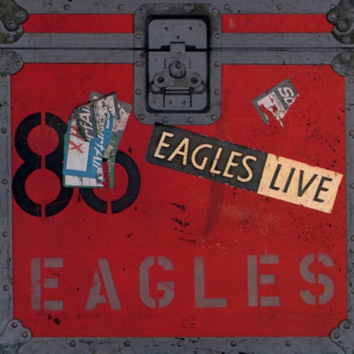 Red metal trunk with "Eagles Live" and ticket stubs on the cover.