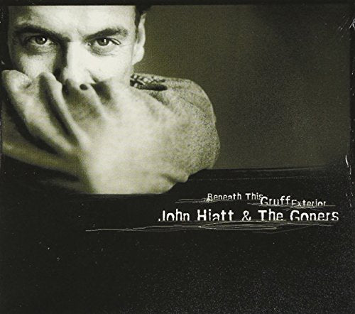 "CD album cover with a black-and-white photo of a man's face and hand."