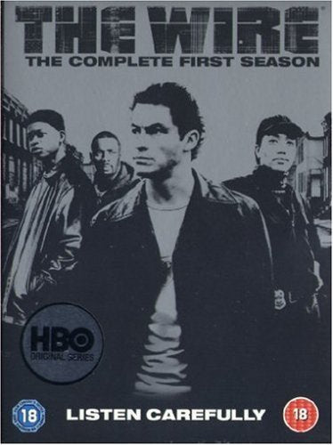 DVD cover for "The Wire: The Complete First Season" with four men standing.