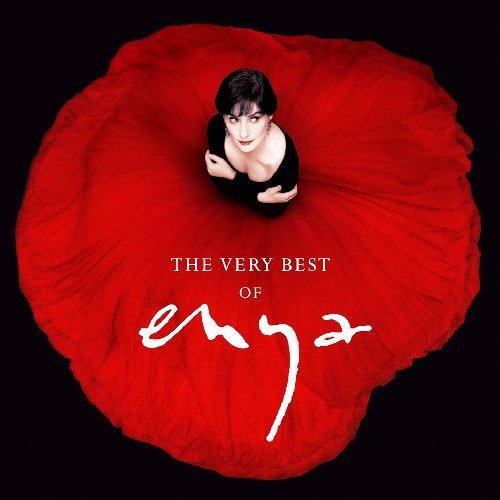 "CD cover featuring Enya sitting in a red flower against a black background."