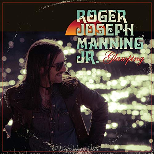 "Album cover featuring Roger Joseph Manning Jr. with blurred lights in the background."
