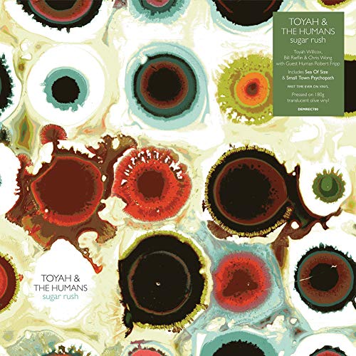 "Album cover for 'Toyah & The Humans - Sugar Rush' with abstract, multicolored eye-like patterns."
