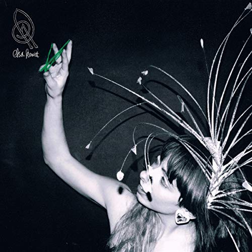 Black and white album cover featuring a woman with a spiky headdress.