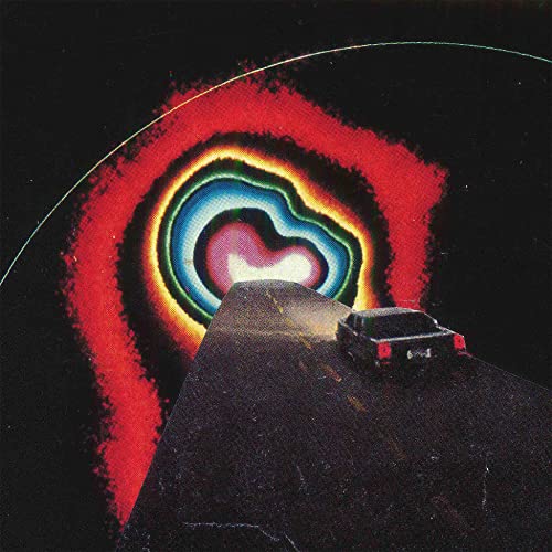 Record album cover with abstract, colorful swirl and a small car.