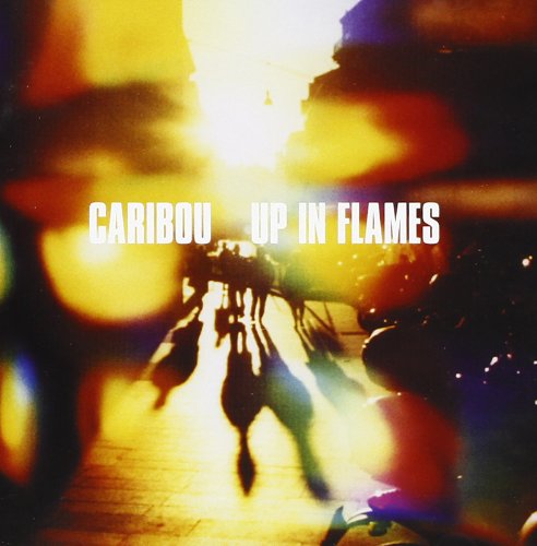 "Album cover for 'Caribou - Up In Flames' with silhouetted horses and bright light."