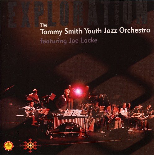 "CD cover featuring a jazz orchestra on stage with a bright spotlight."