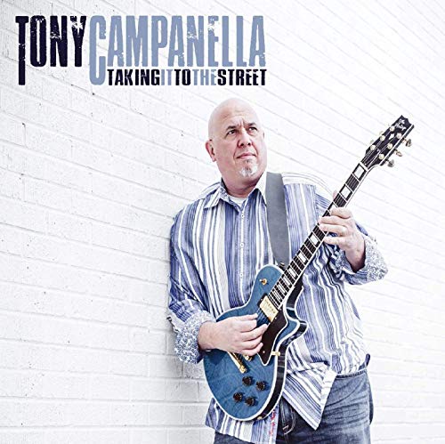 "Album cover of Tony Campanella holding a blue guitar against a white brick wall."