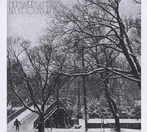 Black and white album cover with a snowy scene and a person walking.