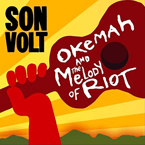 "Album cover with red hand holding guitar head against yellow and orange background."