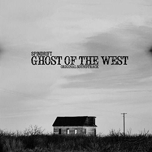 Black and white album cover with a small building and stormy sky.