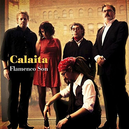 "Album cover featuring five musicians, one kneeling, against a yellow-toned building background."