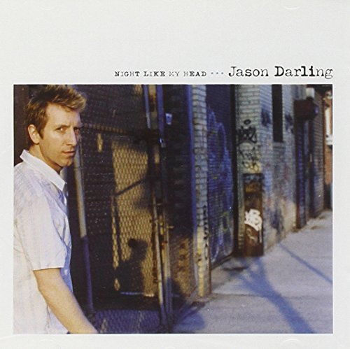 Album cover with a man standing in an alleyway, wearing a white shirt.
