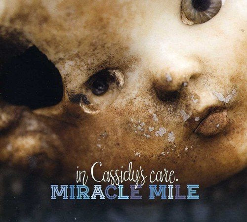 "CD album cover with a close-up image of a dirty baby's face and text."