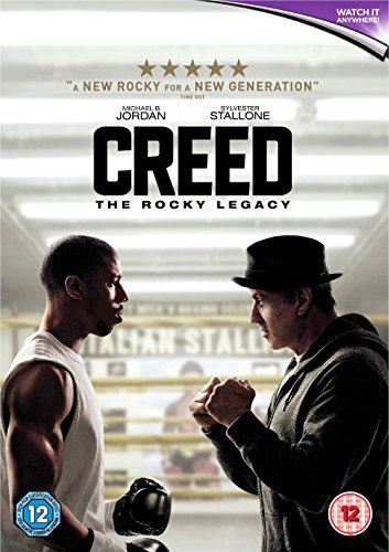 "DVD cover for Creed, featuring two men facing each other in a boxing ring."