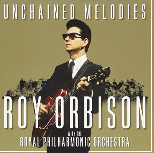 Roy Orbison in sunglasses holding a red electric guitar, album cover.