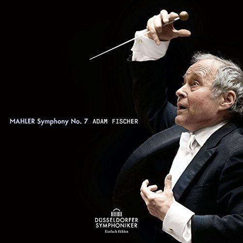 "Conductor in black tuxedo holding baton, against a black background, with white text."