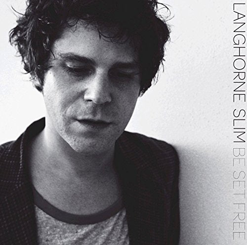 "Black and white album cover with a man looking down, text on the right side."