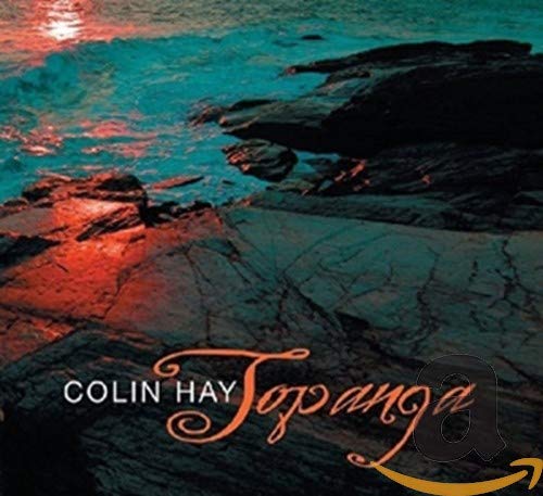CD cover for Colin Hay’s “Topanga” featuring a rocky coastline scene.