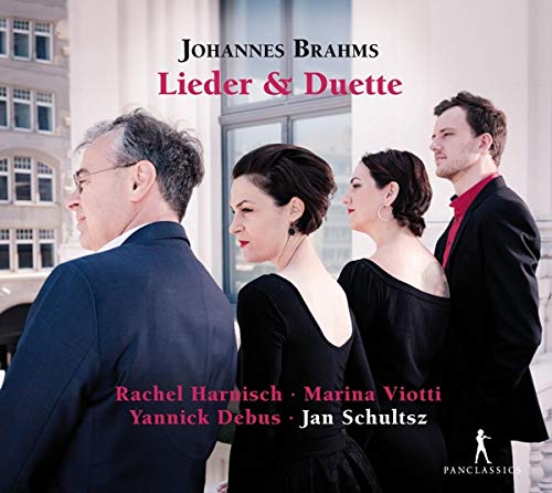 CD cover featuring four classical musicians in formal attire standing together outdoors.