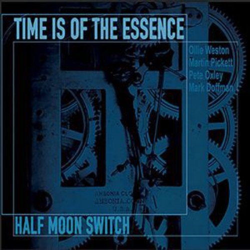 "Blue-tinted clockwork mechanism with 'Time Is Of The Essence' and 'Half Moon Switch' text."