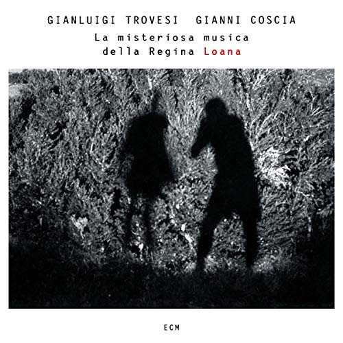 CD cover: Silhouettes of two figures in a dark, textured landscape.