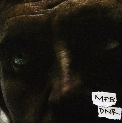 Close-up of a person’s face with a torn paper label reading “MPB DNR”.